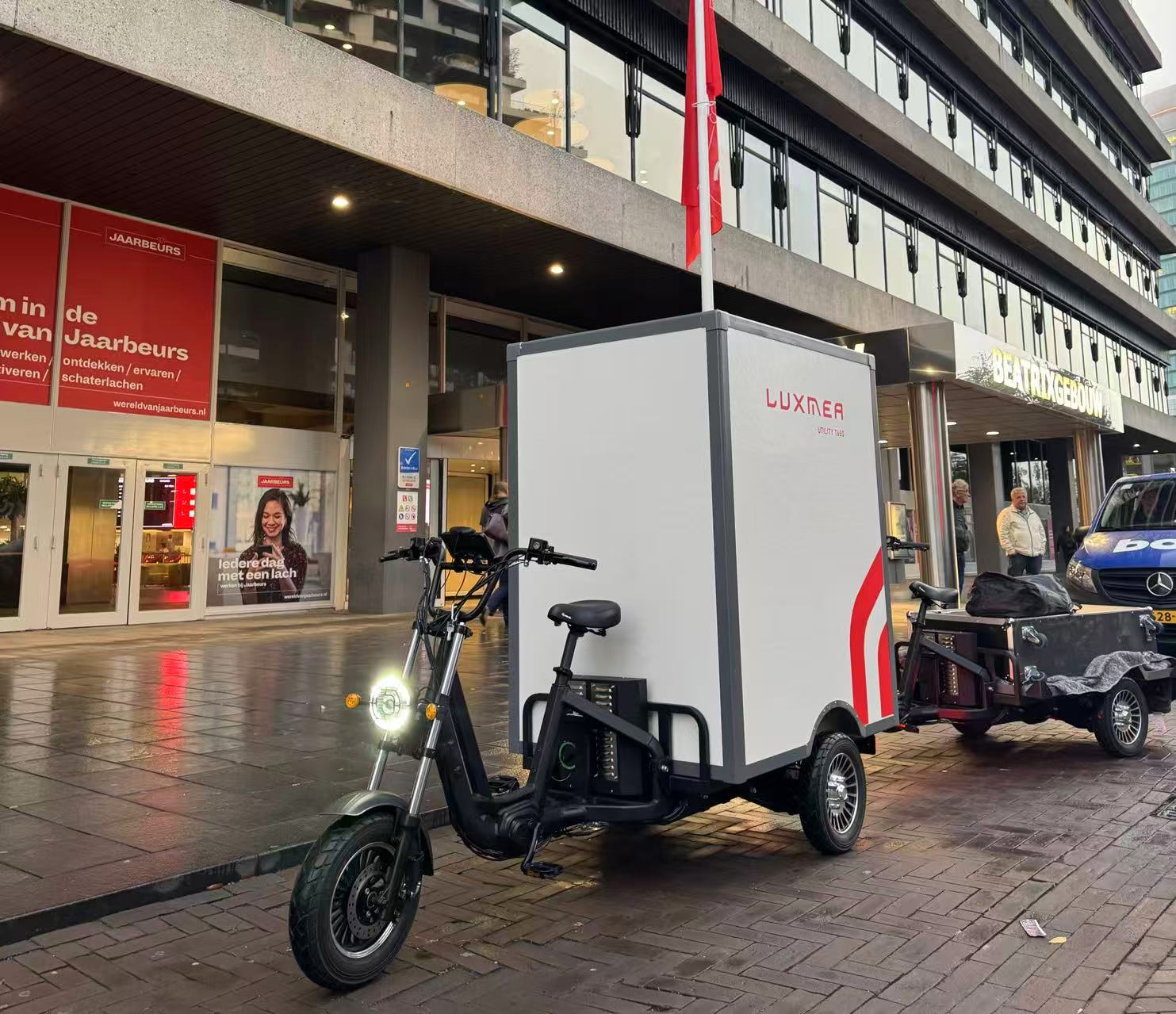 Luxmea heavy-duty electric cargo tricycles with modular cargo boxes, designed for urban delivery and last-mile logistics